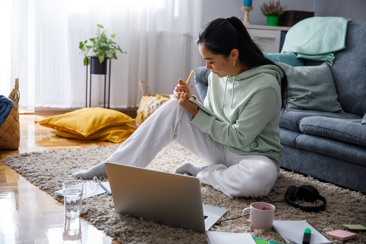 College student working on an essay in her apartment