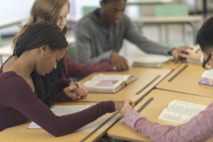 group praying during Bible Study