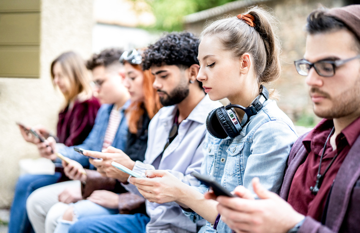 College students on their phones.