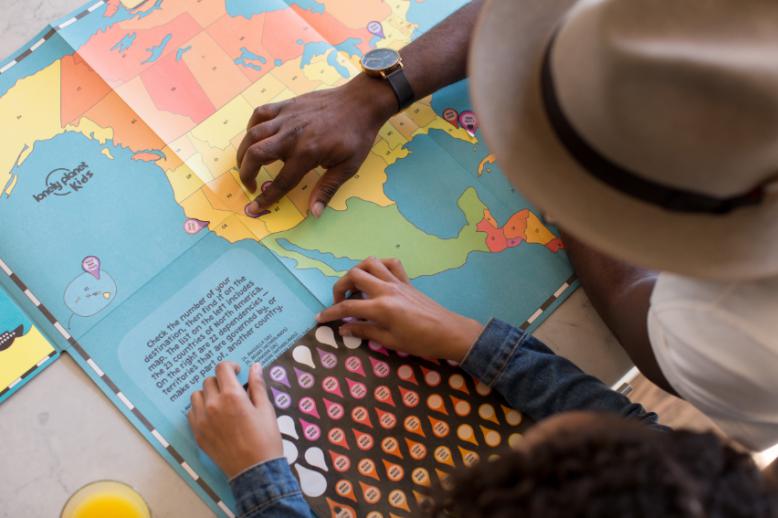 Student and teacher looking at a map