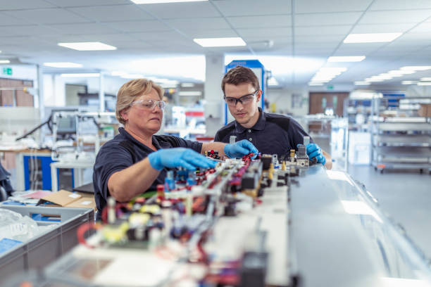 two people working on a circuit